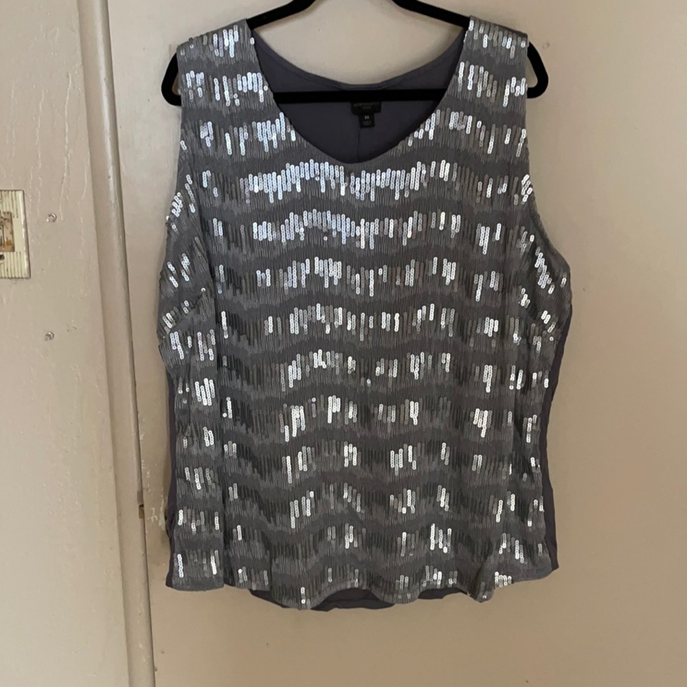 Tank top with sequin in front and knit in back.